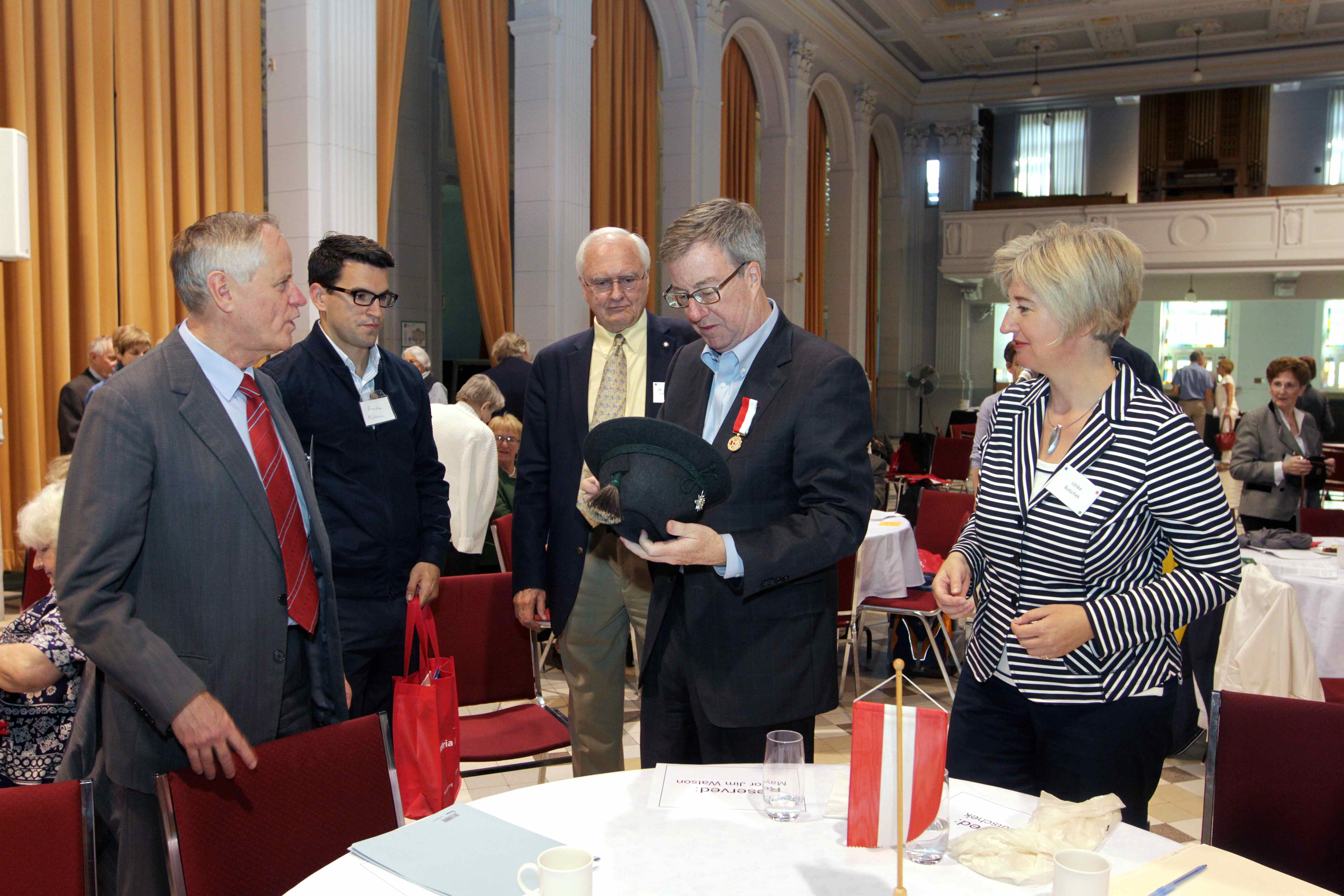 Discussing the Austrian hat Discussing the Austrian hat